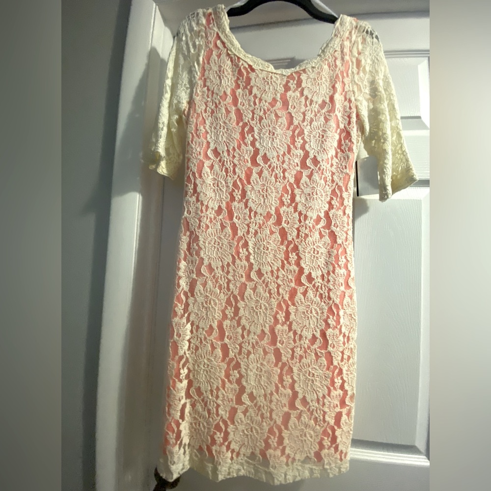 Beautiful half sleeve cream lace dress with pink underlay